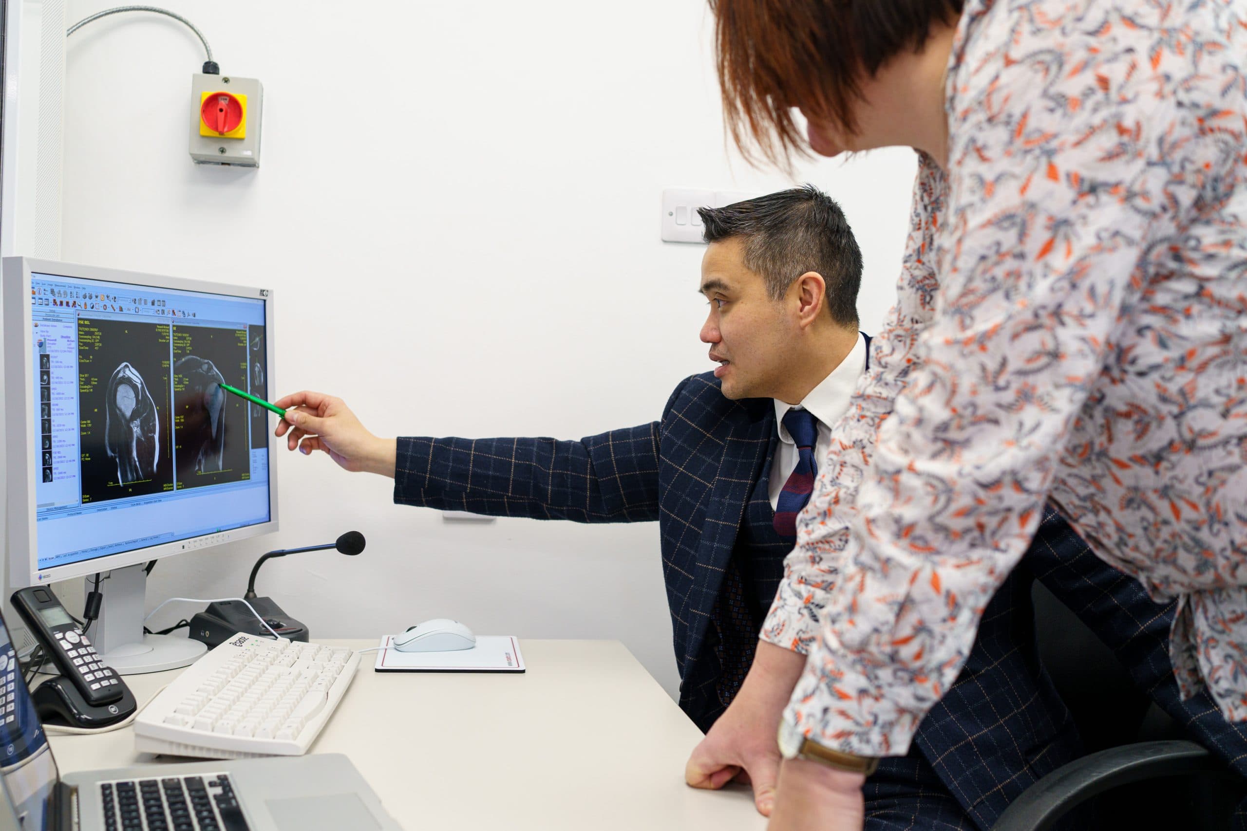 Professor Lee explaining treatment plan during consultation